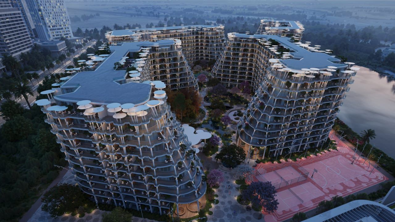 Aerial masterplan view of Sakura Gardens showing four low-rise towers around a landscaped green heart